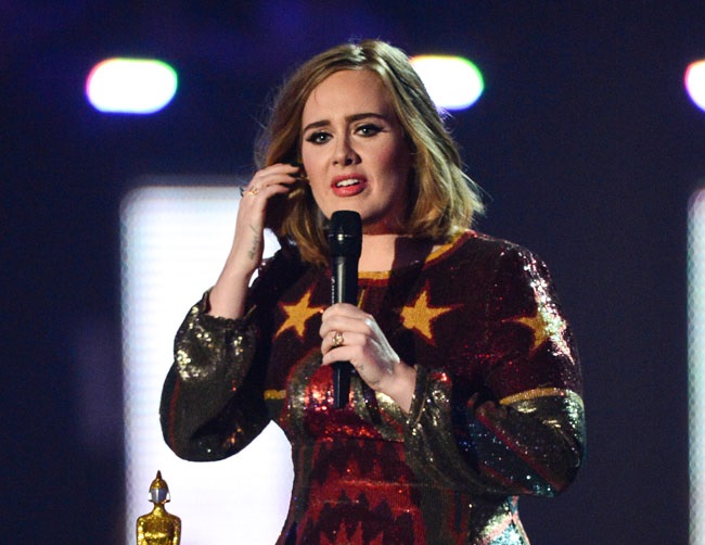 Adele wants to stop swearing